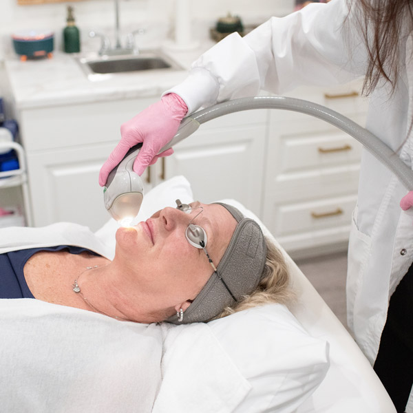 woman receiving laser treatment