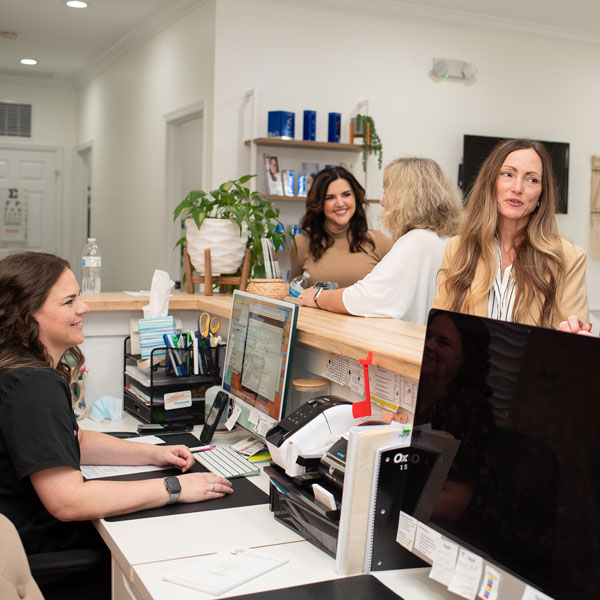 group of women at reception desk