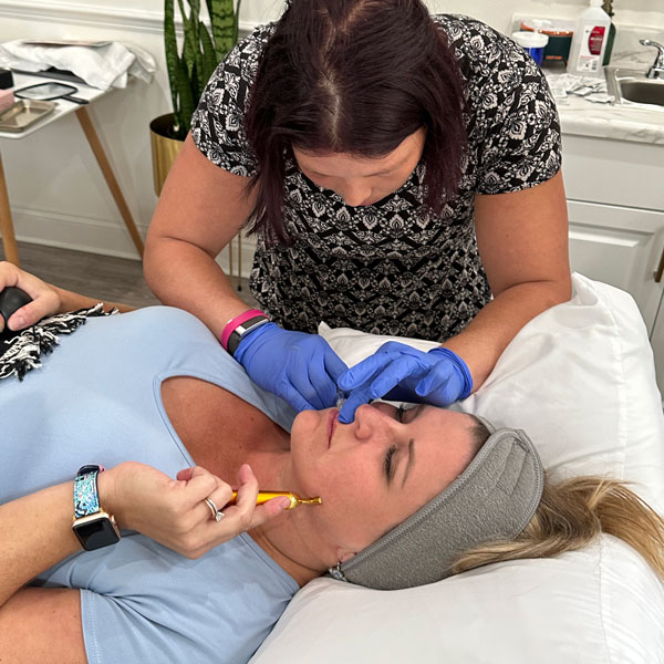 woman receiving facial injection