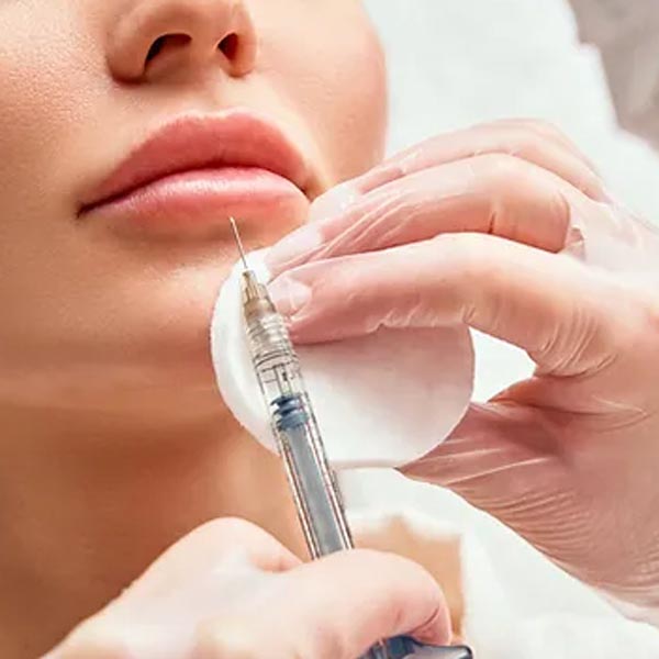 woman receiving lip injection