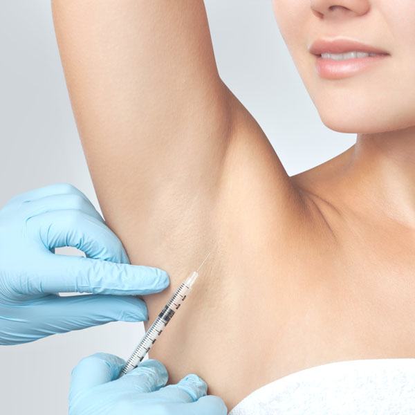 woman receiving armpit injection