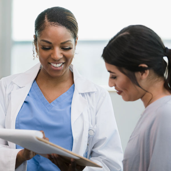 nurse talking with patient prior to treatment