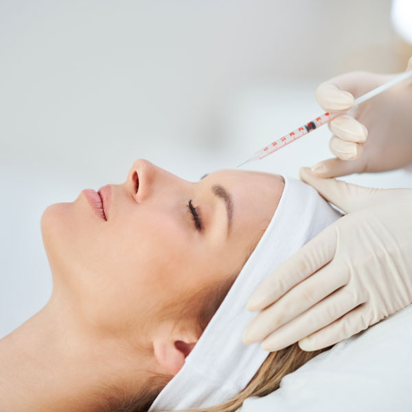 woman receiving facial injection