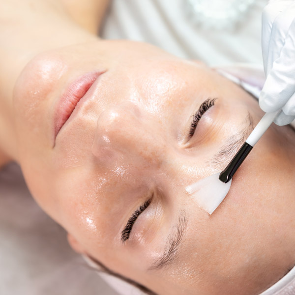 woman receiving facial treatment