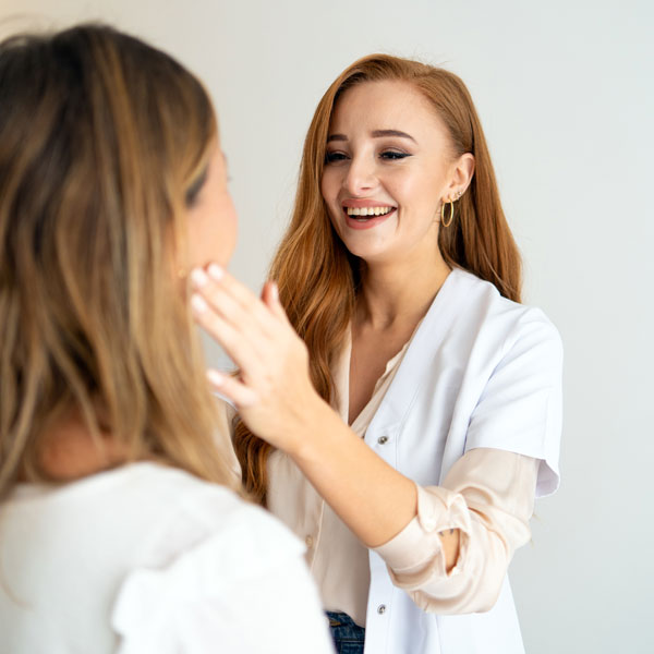 doctor examining patient's face