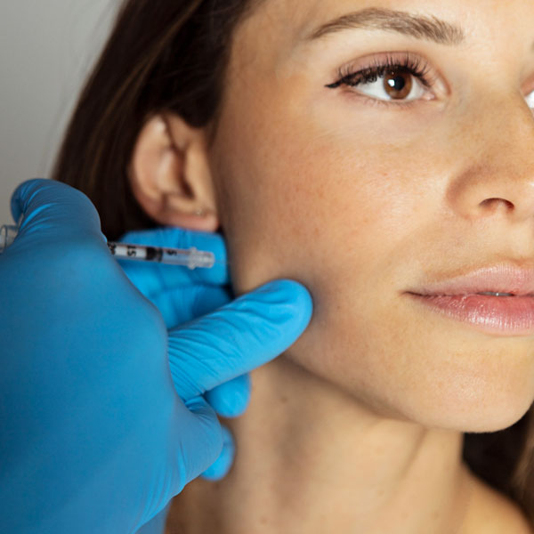 woman receiving facial injection