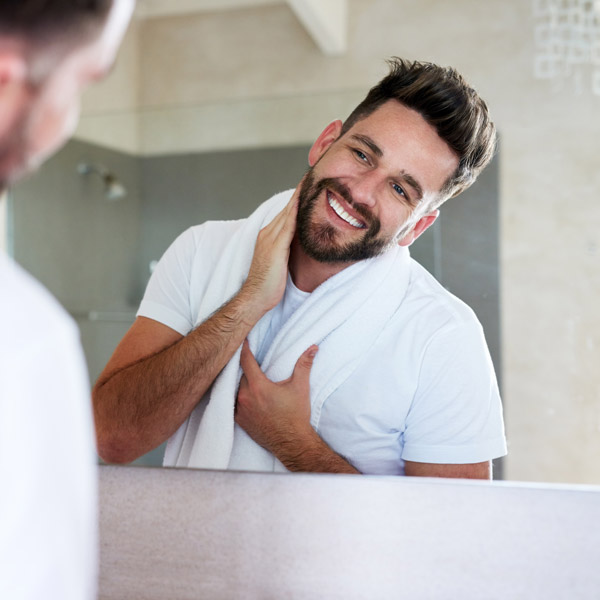 man admiring reflection in the mirror