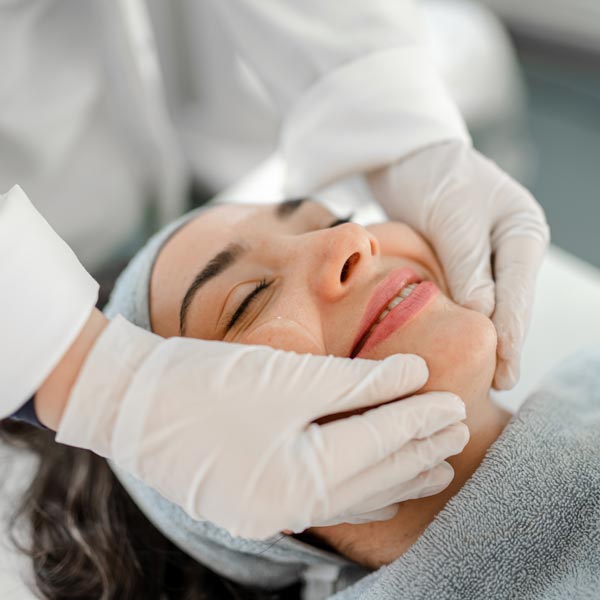 woman receiving facial massage