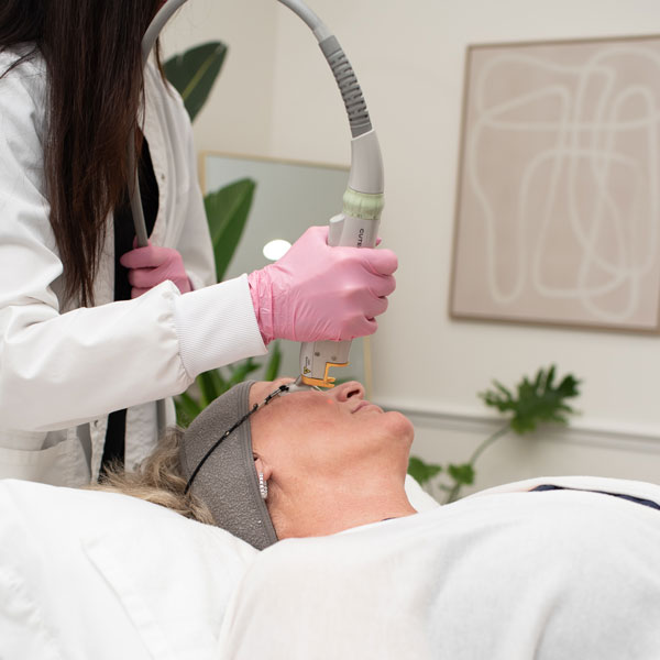 2D laser facial being administered to client