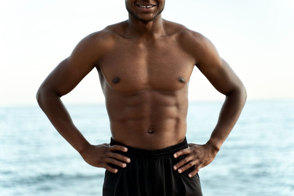 Toned man at beach