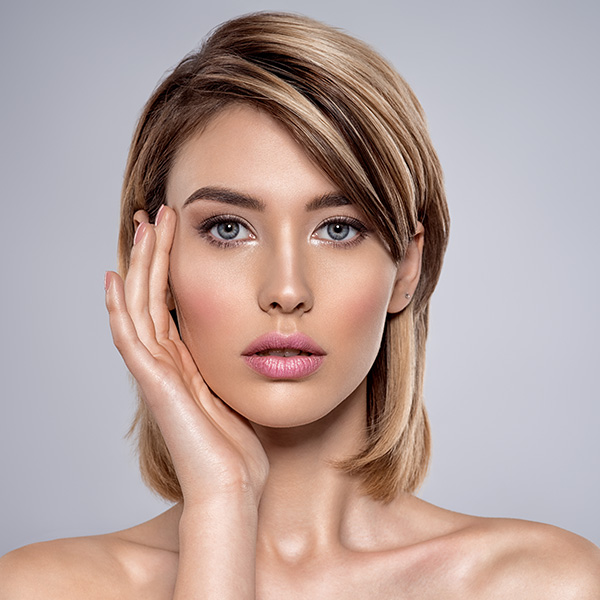 woman with clear skin looking at camera